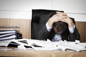 Frustrated business person overloaded with work. Frustrated business person overloaded with work.